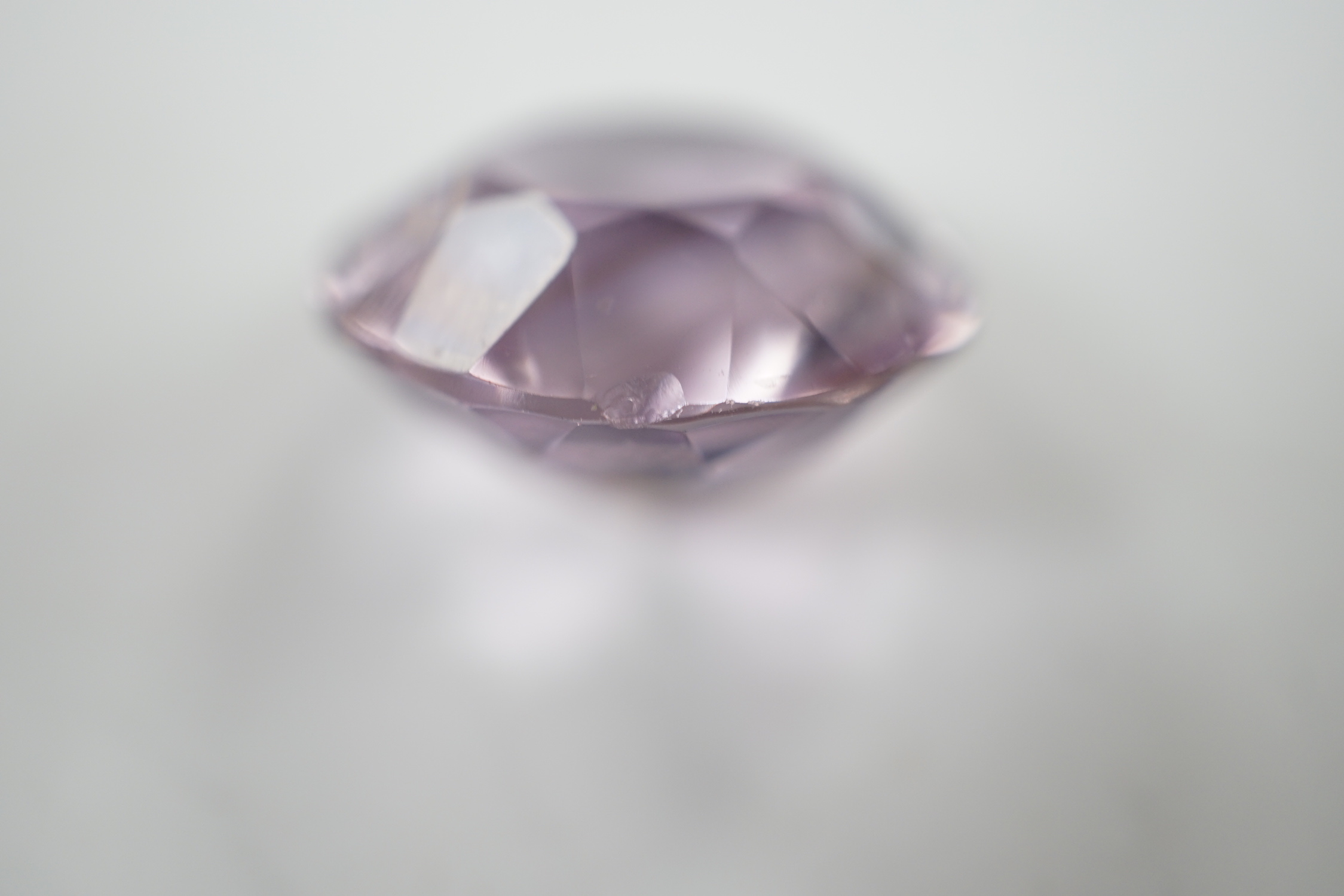 An unmounted round cut amethyst, weighing approximately 15.9ct.